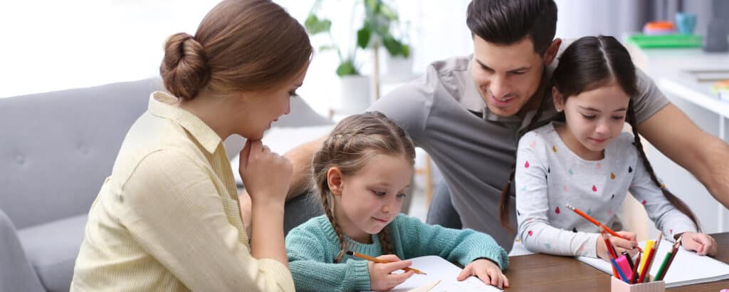Parents working from home teaching kids